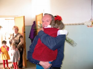 Katya with her flowers, meeting Dyedushka Bill for the first time.