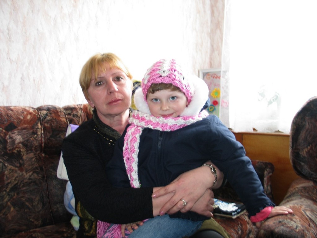 Katya with one of the orphanage workers, just before she left, forever.