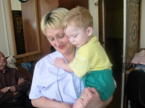 Changing Kirrill’s clothes just before rushing him out of the orphanage