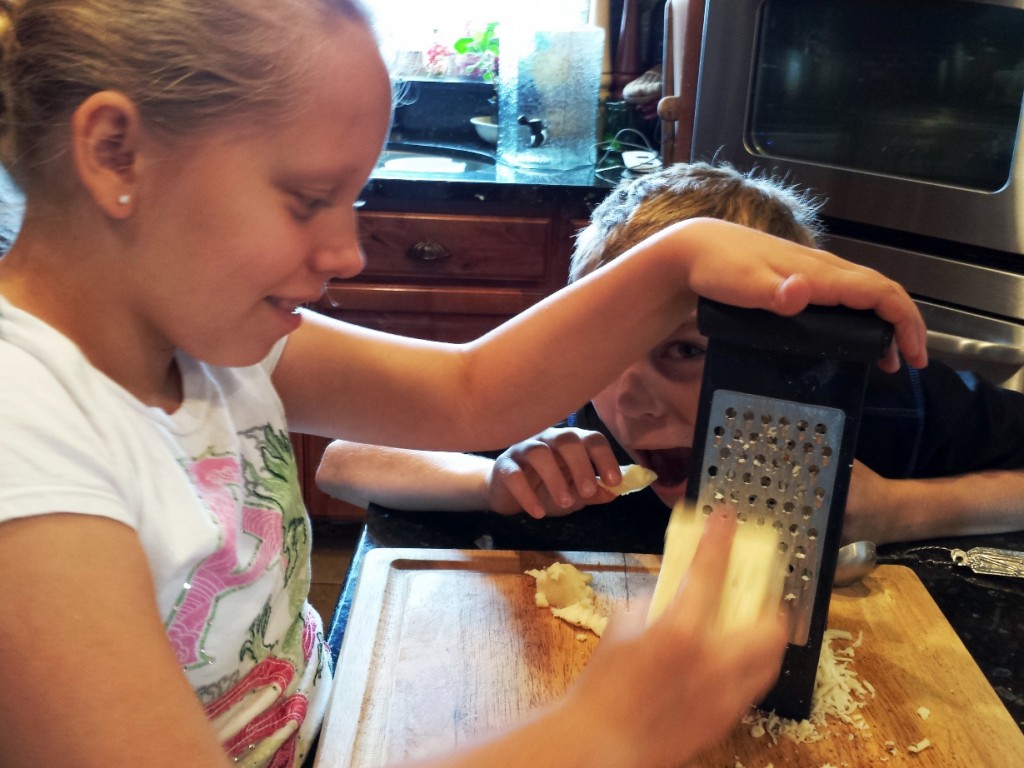 Denney helping Celeste with the cheese.  