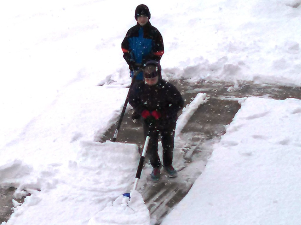 Denney and Celeste shoveling snow
